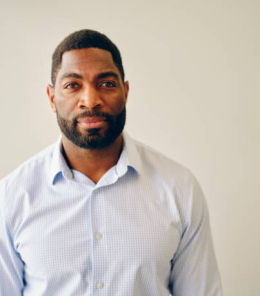 A natural light portrait of an African American man.